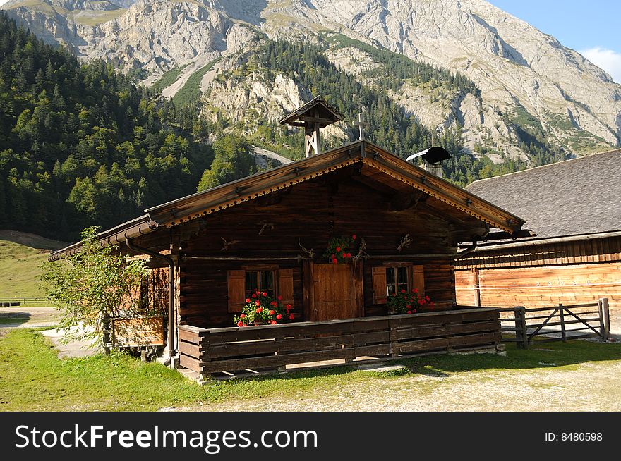 A farm house in an alpine village. A farm house in an alpine village.
