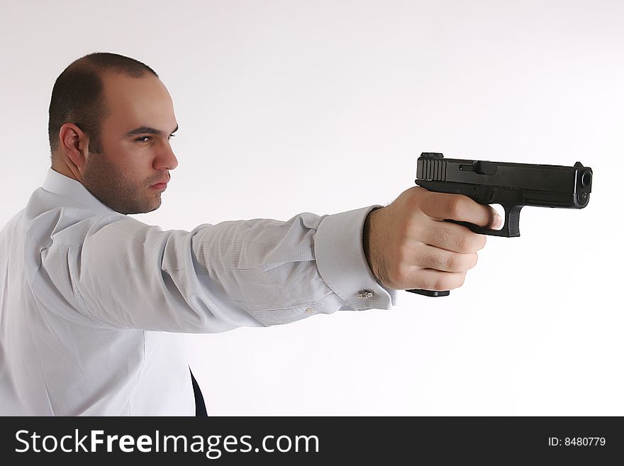 Profile of a man with gun in his hand. Profile of a man with gun in his hand