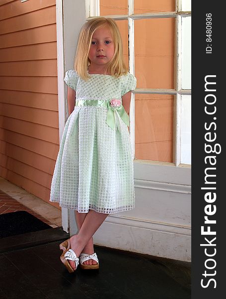 Young Girl leaning against a door. Young Girl leaning against a door.