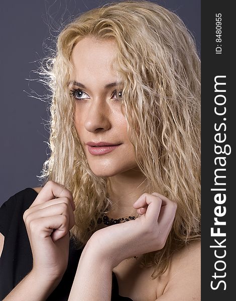 Blond Black Necklace Holding Hair