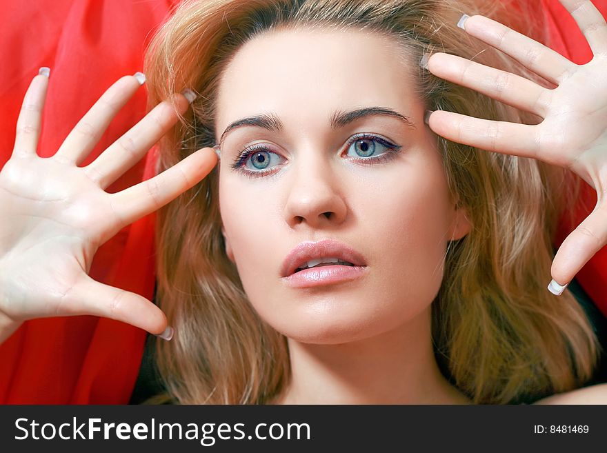 Beautiful blonde with a red scarf on a head. Beautiful blonde with a red scarf on a head