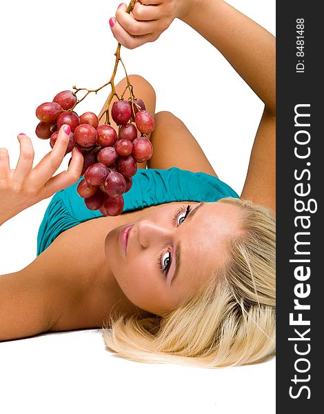 Blonde girl in blue with grapes