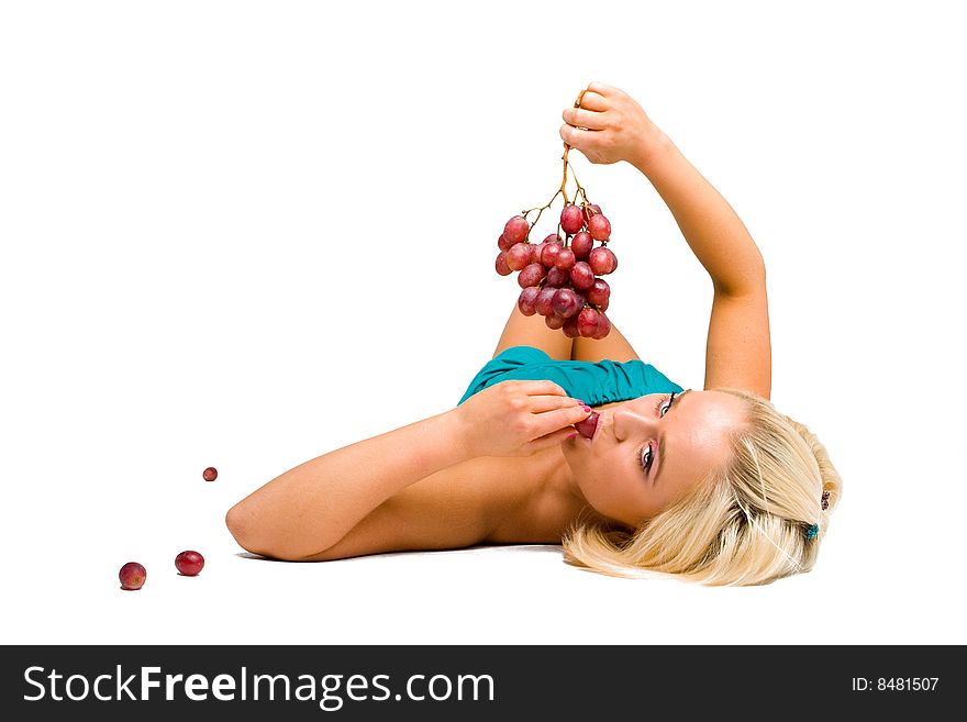 Blonde girl in blue with grapes