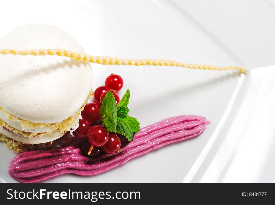 Meringue Cake with Blackberries Mousse and Fresh Mint Leaf and Fresh Berries