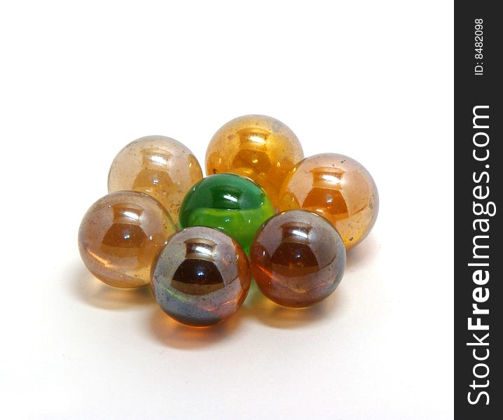 Varicoloured abstract glass balls on a white background