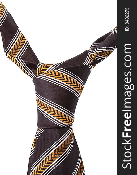 Brown necktie with yellow and white pattern isolated on white background