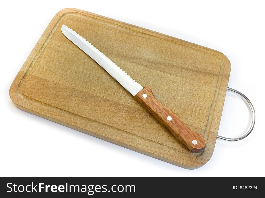 Chopping board and knife for bread, a photo close up on a white background.