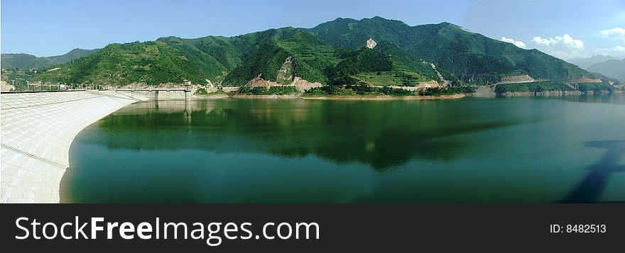 Panoramic View Of Reservoir In Mountain