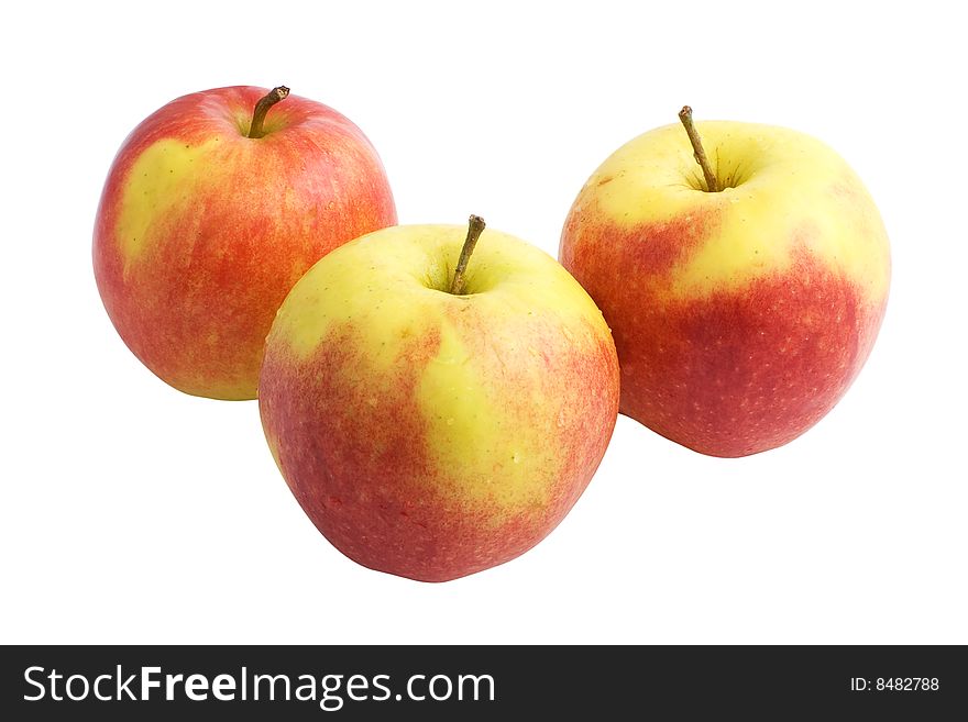 Three red and yellow apples isolated on white background