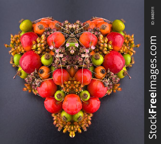 Heart-shaped flower arrangement with dried flowers