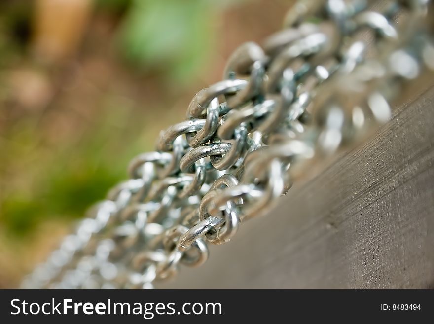 Close-up several parallel steel chains with shallow depth of field. Close-up several parallel steel chains with shallow depth of field