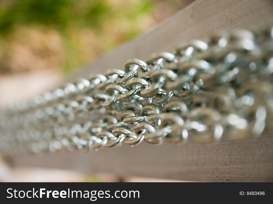 Close-up several parallel steel chains with shallow depth of field. Close-up several parallel steel chains with shallow depth of field