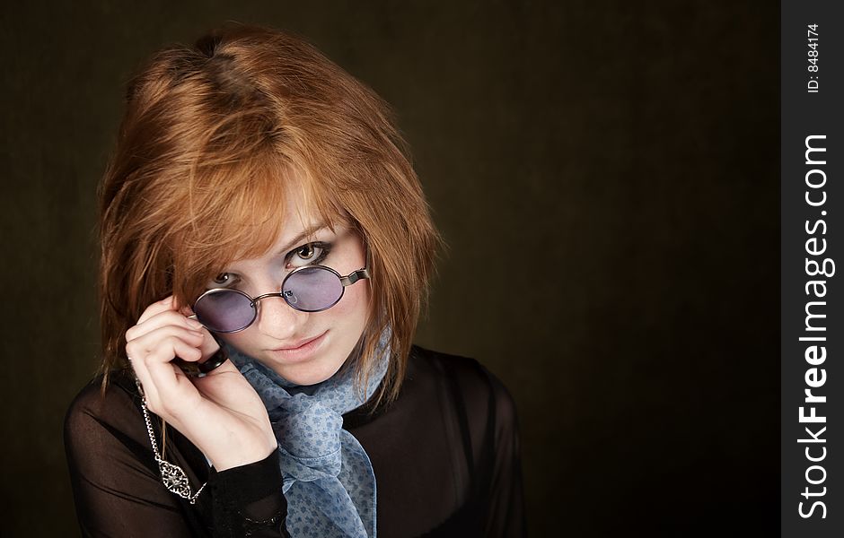 Pretty teenage girl with round blue sunglasses. Pretty teenage girl with round blue sunglasses