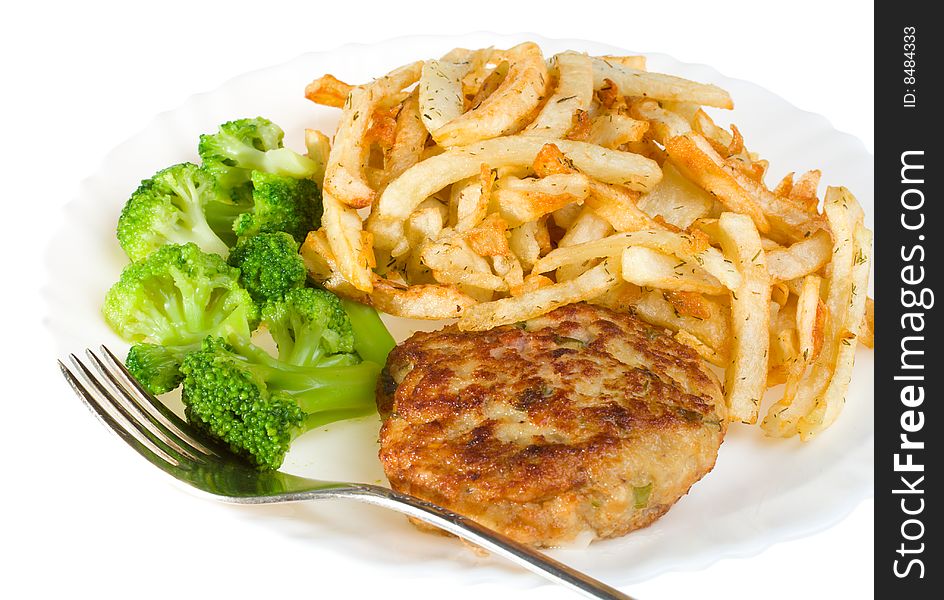 Cutlet with broccoli and potatoes on plate, isolated