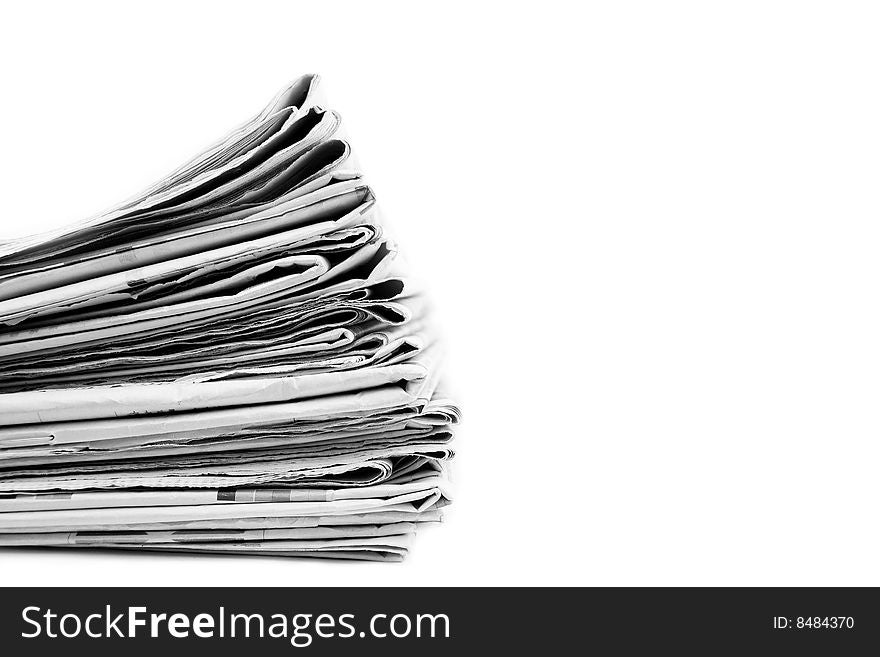 Stack of newspapers in black and white isolated