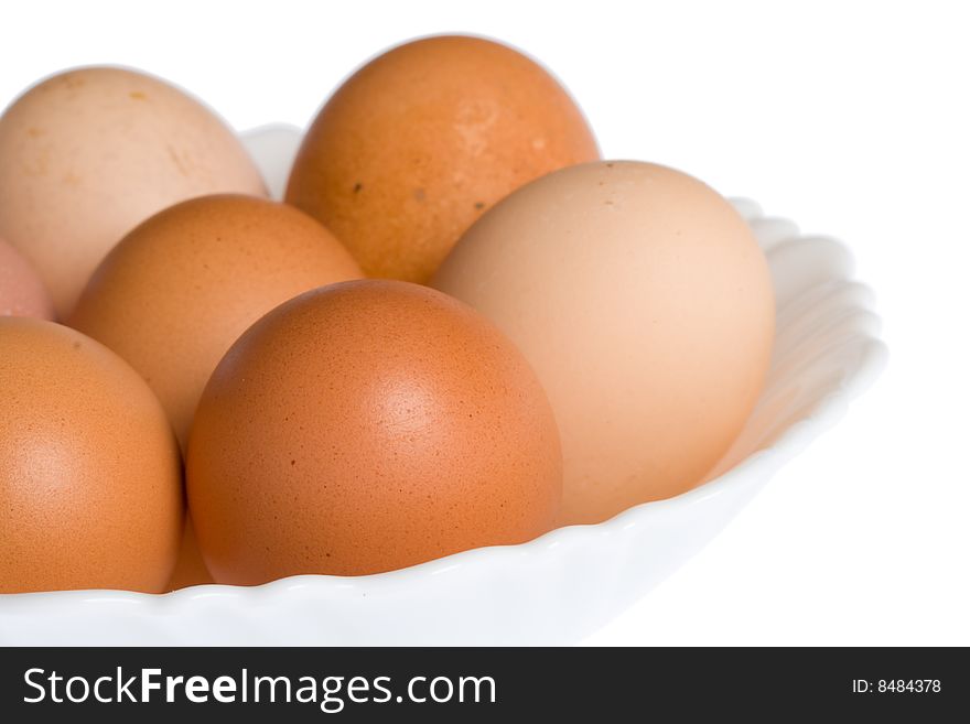Close-up eggs on plate, isolated over white. Close-up eggs on plate, isolated over white