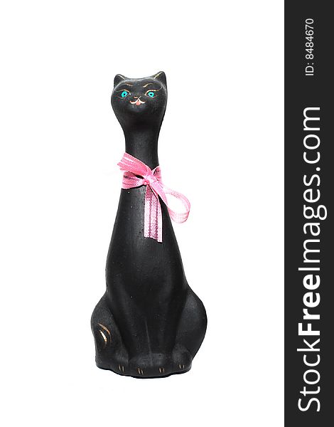 Black cat statuette under the white background