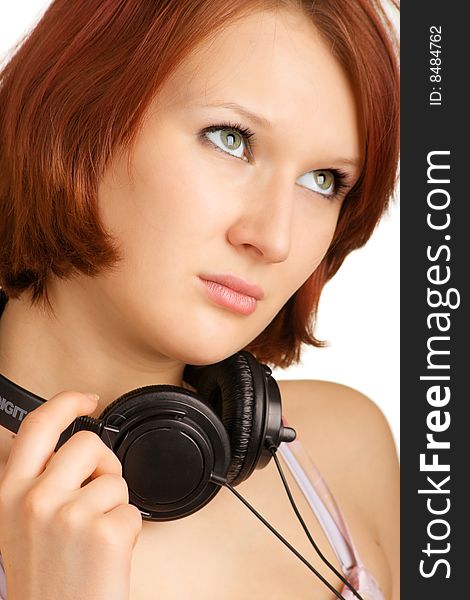 Attractive girl with headphones around her neck
