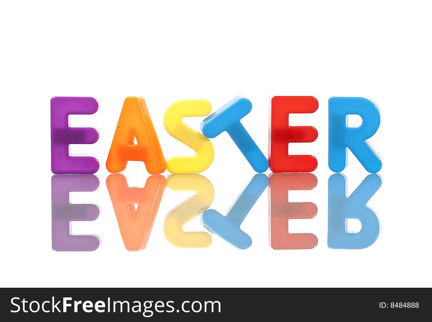 Easter word made with plastic letters isolated on white background