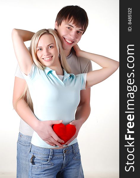 Young loving couple isolated at white background
