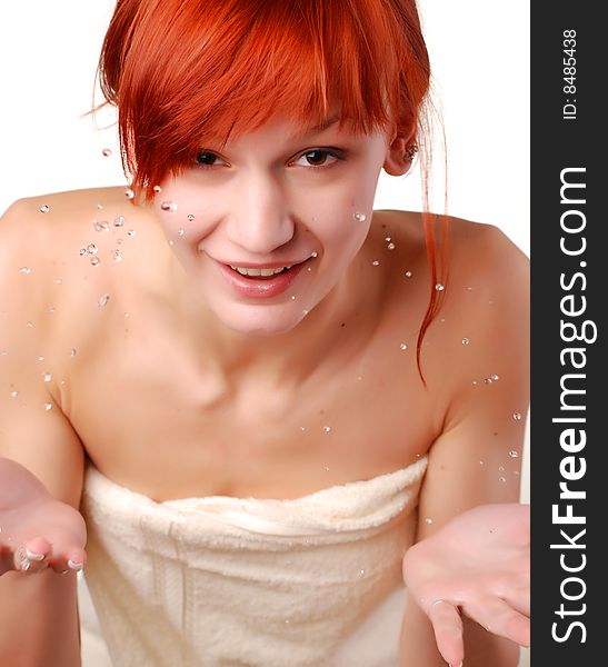 Beautiful young woman washing her face with water. Beautiful young woman washing her face with water