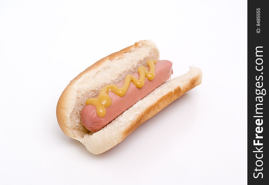 Hot dog with mustard isolated on a white background