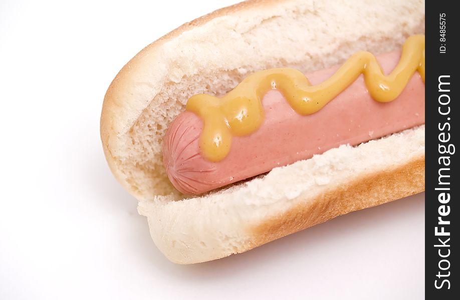 Hot dog with mustard isolated on a white background