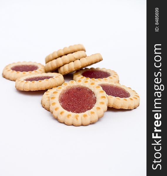 Sweet biscuits filled with raspberry 	
isolated on a white background