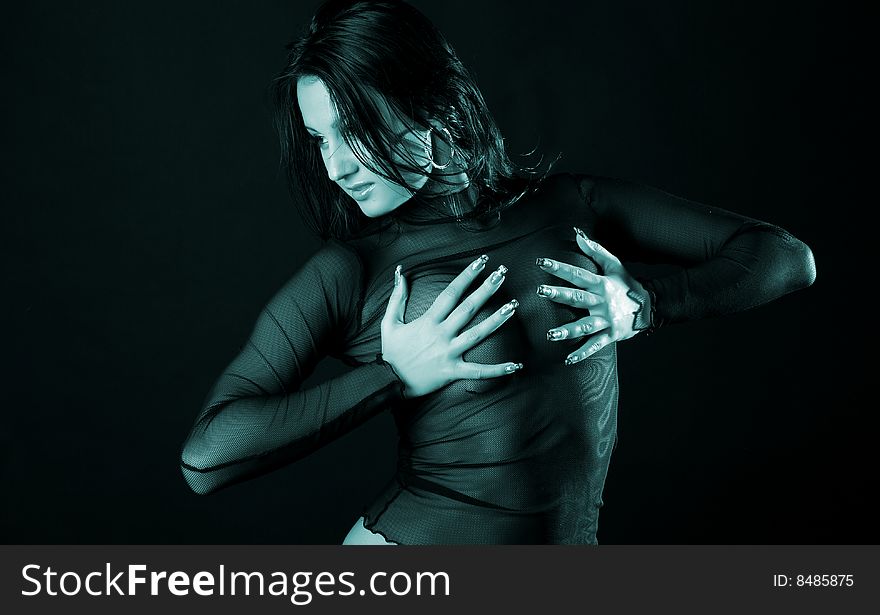 Woman in transparent black clothes on black background. Woman in transparent black clothes on black background