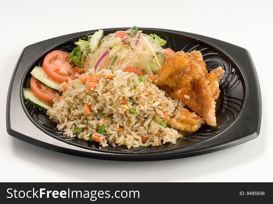 Stir-fried rice with chicken and a salad