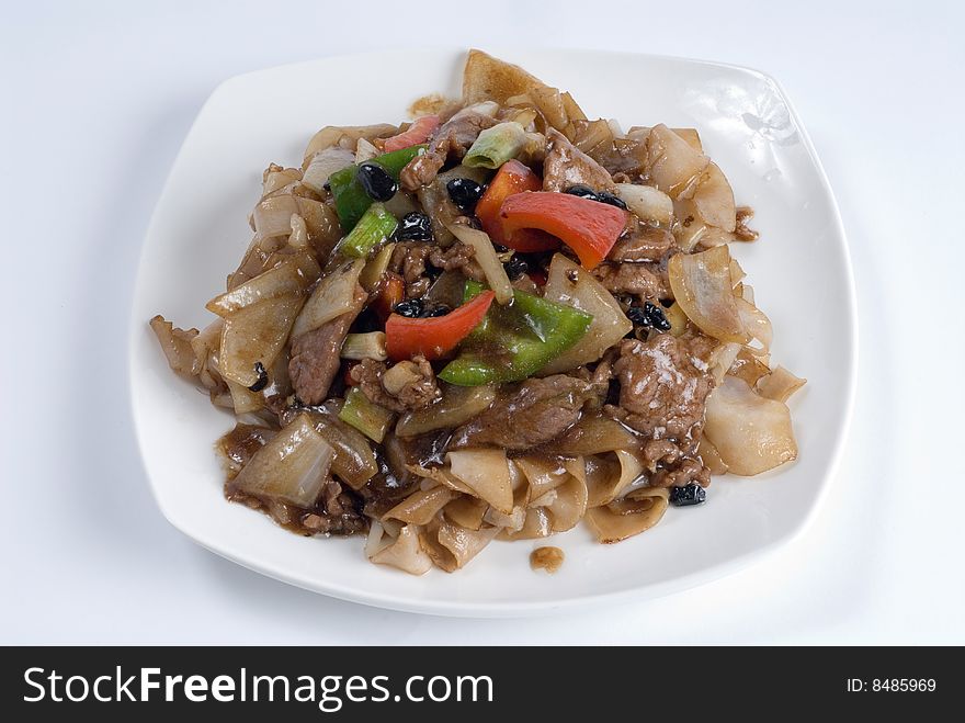 Seasoned beef and peppers over egg noodles