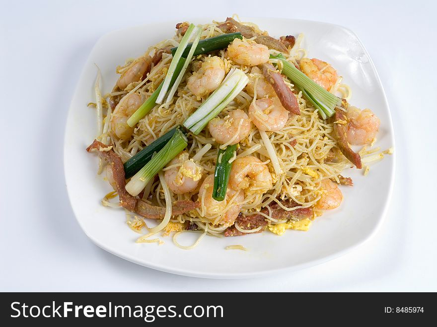 Stir-fry shrimp and pork over noodles