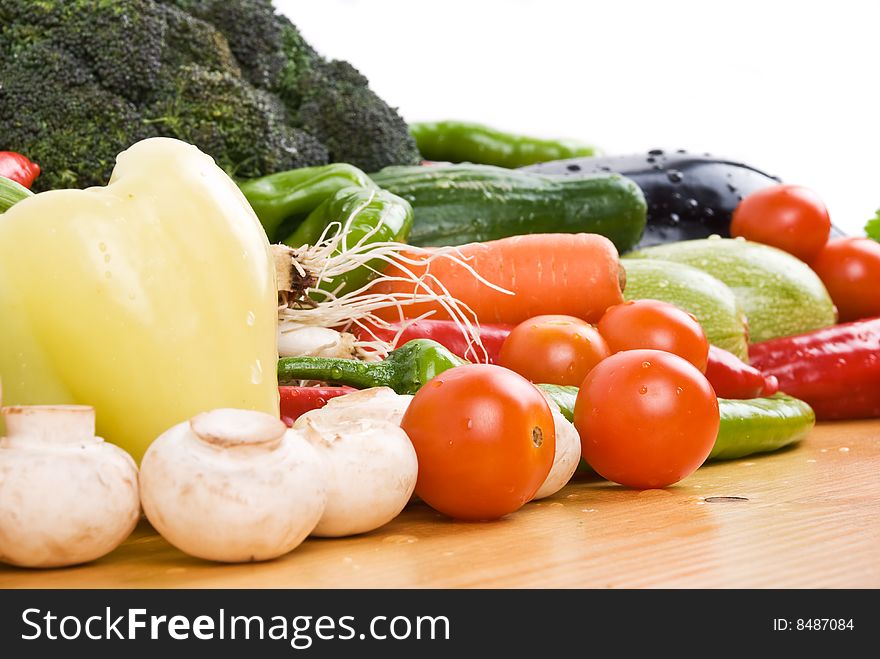 Close up of fresh vegetables on a wood table in kitchen,check also Healthy food