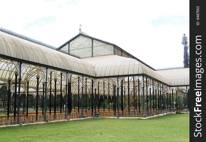 This is a large glass house which has been constructed with a lot of lean metal pillars which adds strength and elegance to the building. It is from lalbagh, Bangalore, India. This is a large glass house which has been constructed with a lot of lean metal pillars which adds strength and elegance to the building. It is from lalbagh, Bangalore, India.