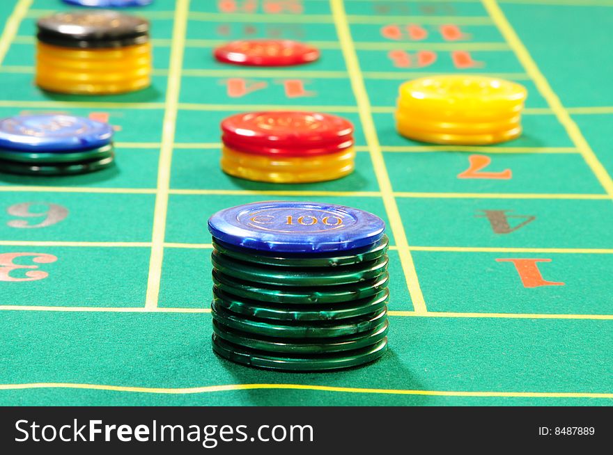 Casino chips on green felt