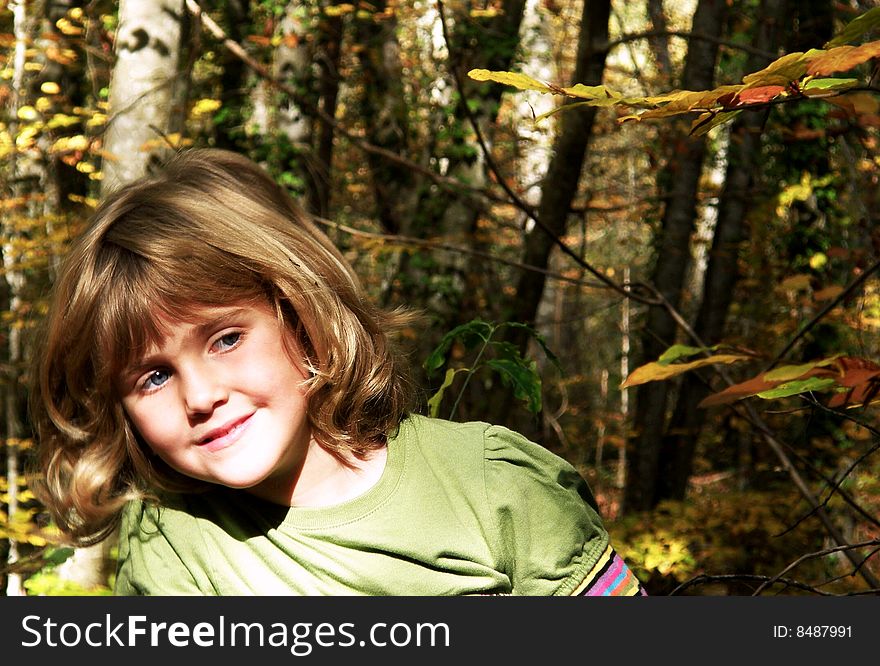 Portrait of  and adorable young girl
in the forest. Portrait of  and adorable young girl
in the forest