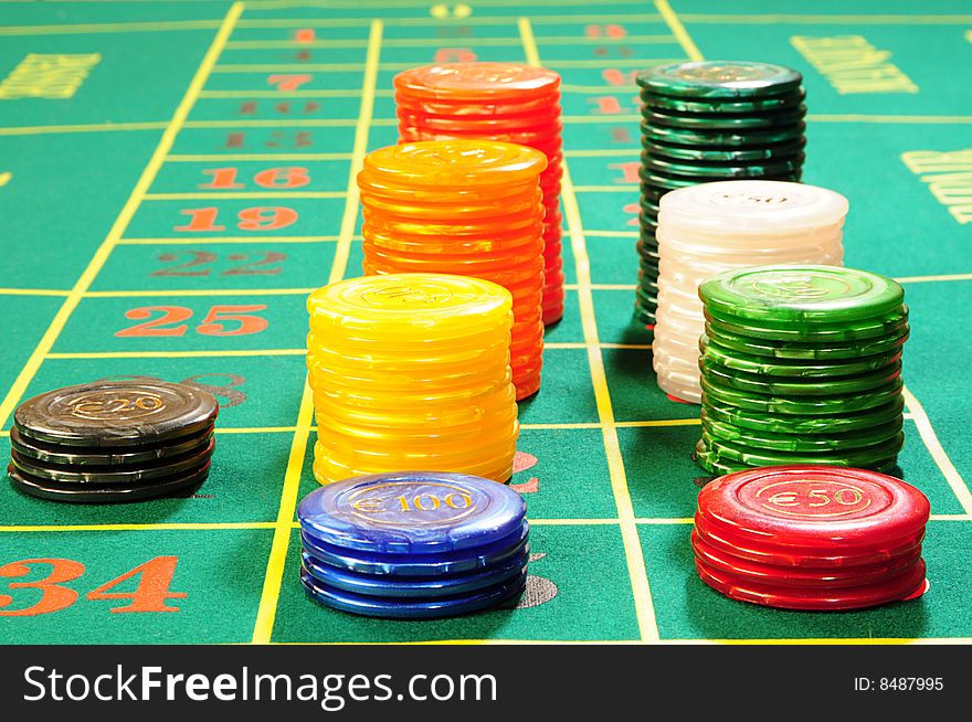 Casino chips on green felt