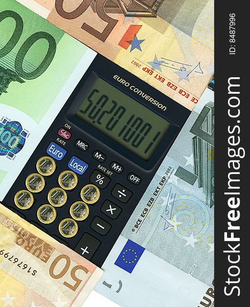 Euro paper currencies with calculator, closeup.