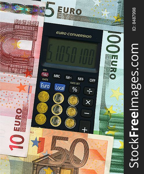 Euro union paper banknotes with calculator and coins. Euro union paper banknotes with calculator and coins.