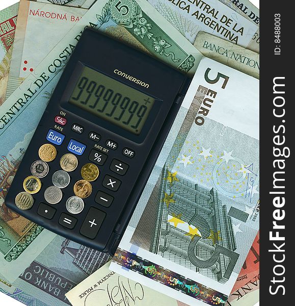 Calculator and coins with paper banknotes from around the world. Calculator and coins with paper banknotes from around the world.