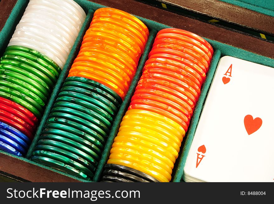 Casino chips and playing cards in box