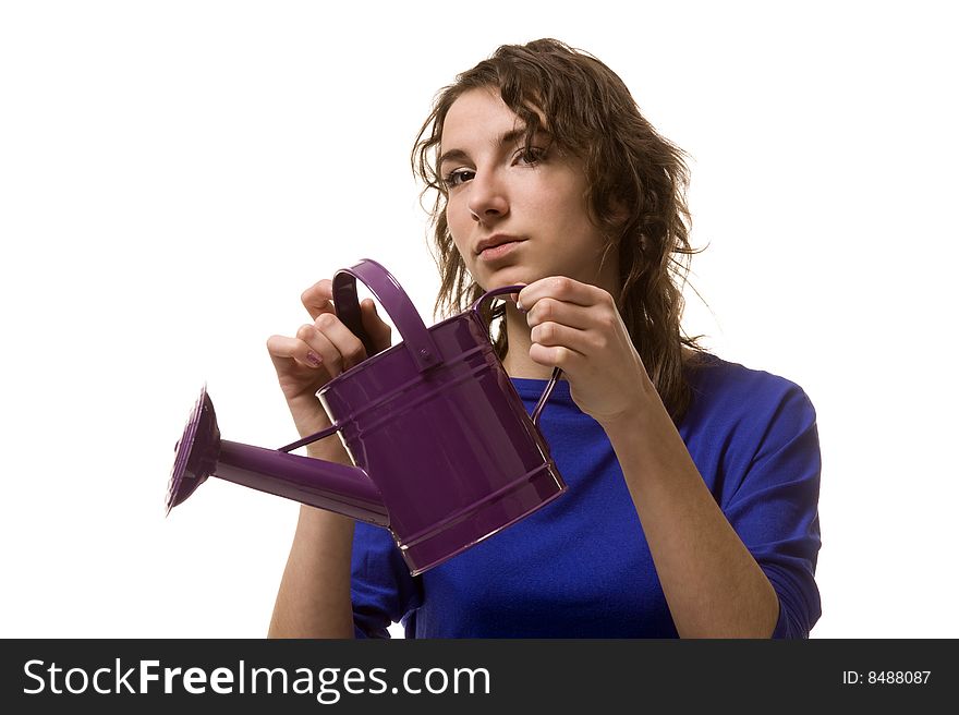 Girl keeps in hands purple watering can. Girl keeps in hands purple watering can