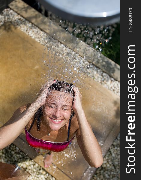 Girl in the outdoor shower