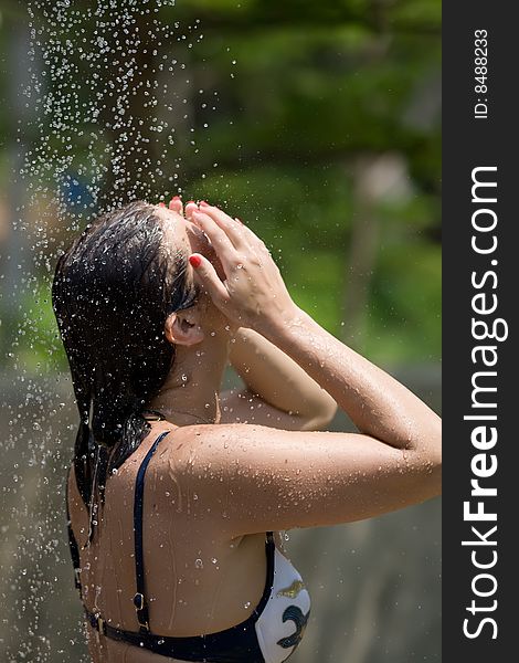 Girl in the outdoor shower