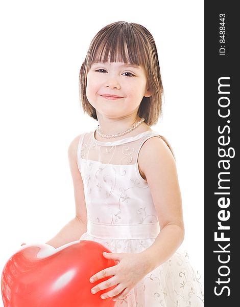 Smiling little girl holds on red balloon