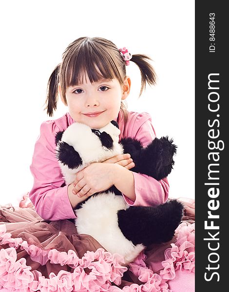 Sitting little girl embraces bear panda. Sitting little girl embraces bear panda