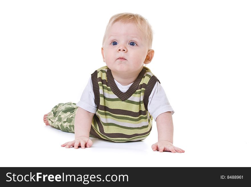 Thoughtful baby lies on floor. Thoughtful baby lies on floor