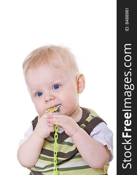 Little boy in a green vest on white background