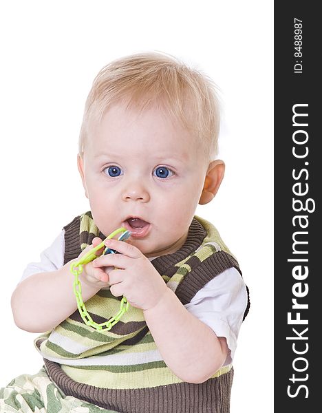 Little boy in a green vest on white background