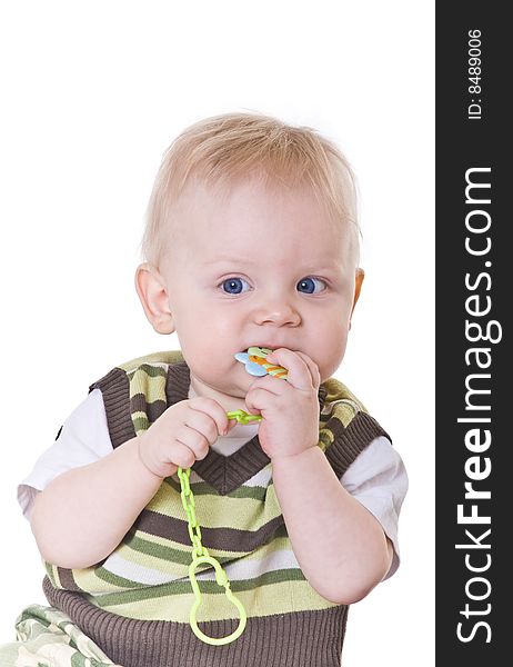 Little boy in a green vest on white background